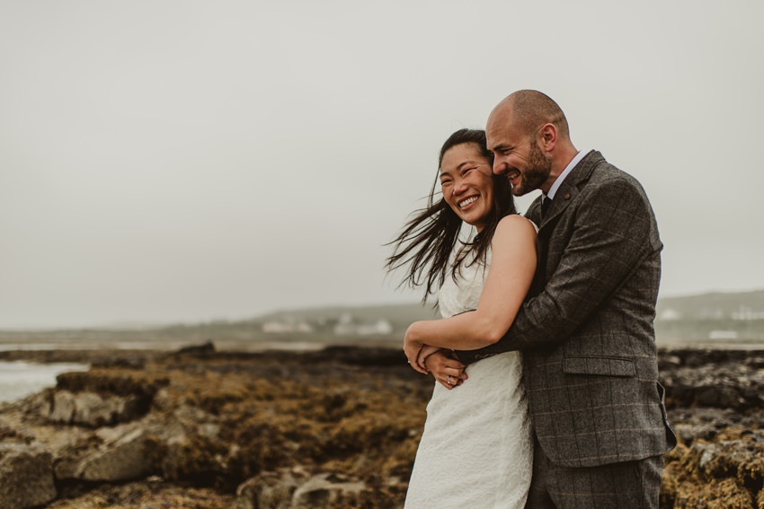 windy weather at wedding, messy hair at wedding, intimate wedding, elopement photographs Ireland
