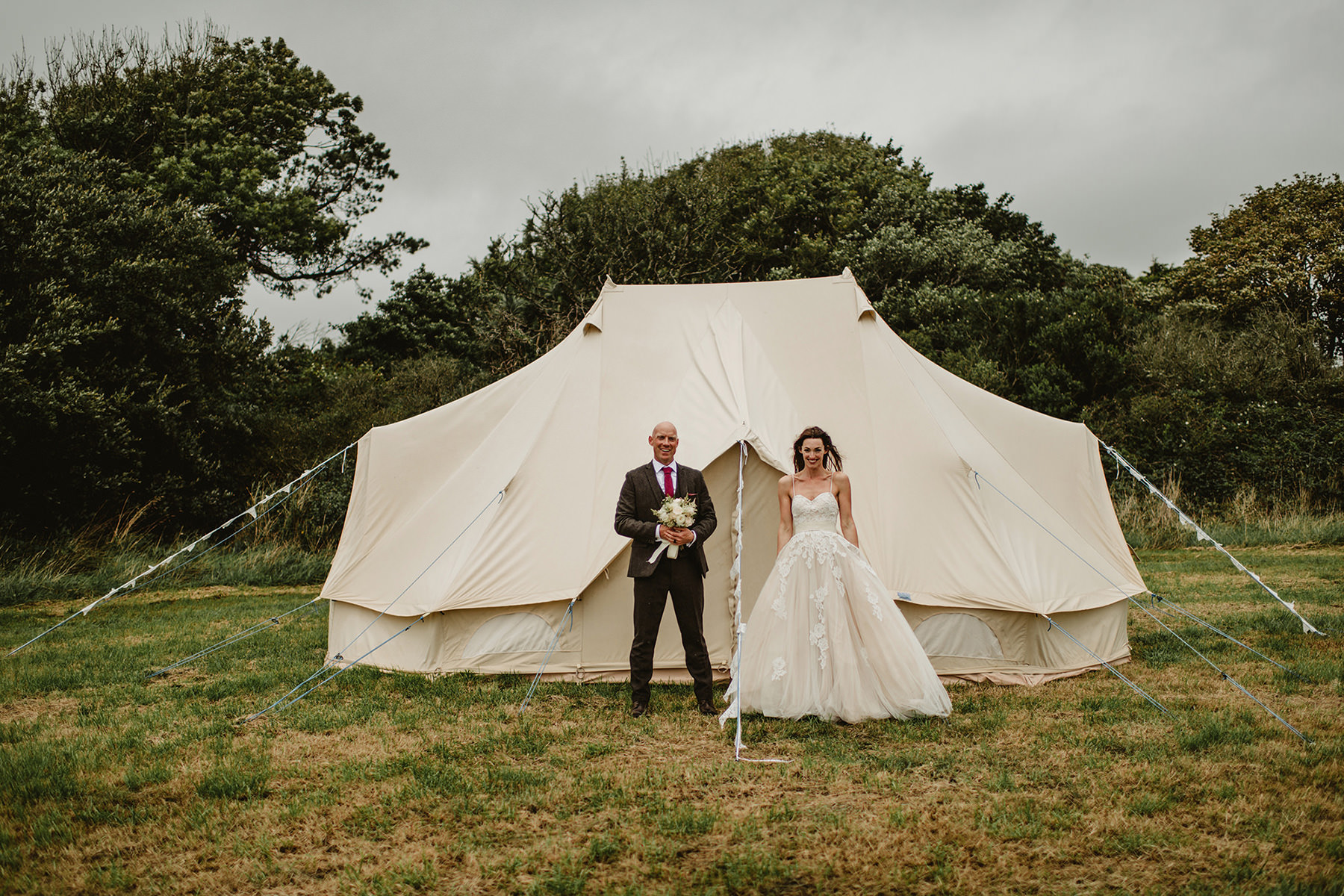 Couples on front of big tent at  garden wedding, garden wedding in Ireland